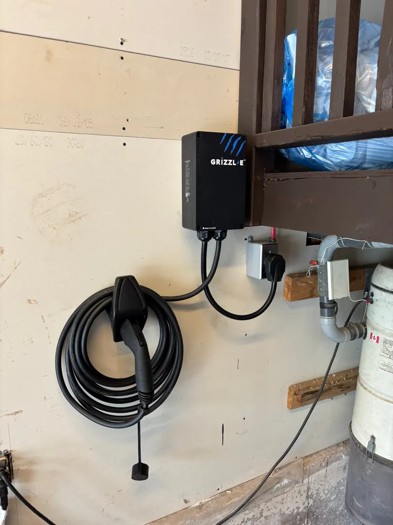 Wall-mounted Grizzl-E level 2 electric vehicle charger installed in a garage